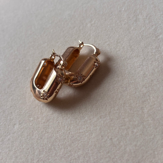 Solar Glow Hoops – Sculpted Gold Earrings with Starburst Crystals